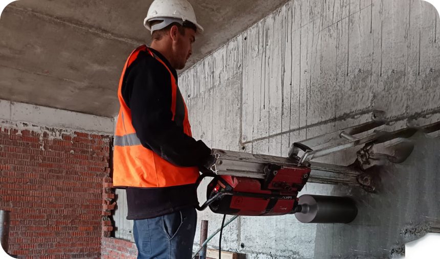 Core drilling equipment cutting through concrete